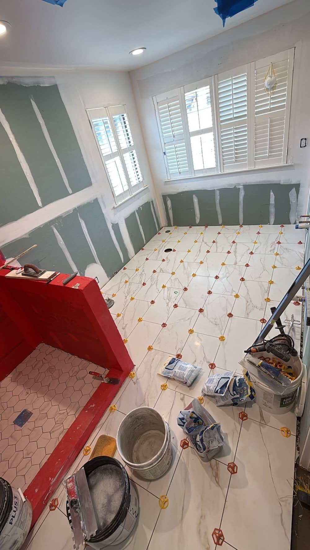 Remodelers working in bathroom